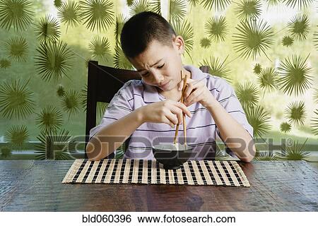 Asian boy eating bowl of rice View Large Photo Image Stock Photograph - Asian boy eating bowl of rice. Fotosearch