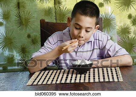 Asian boy eating bowl of rice View Large Photo Image Stock Photography - Asian boy eating bowl of rice. Fotosearch