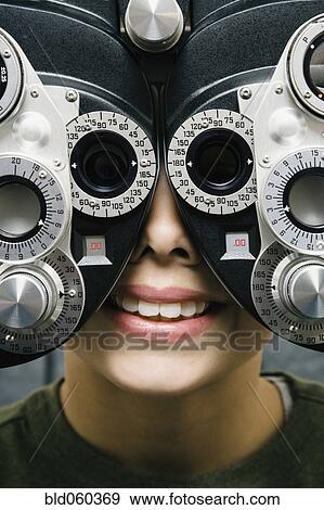 Asian boy having eyes examined View Large Photo Image Stock Photo - Asian boy having eyes examined. Fotosearch