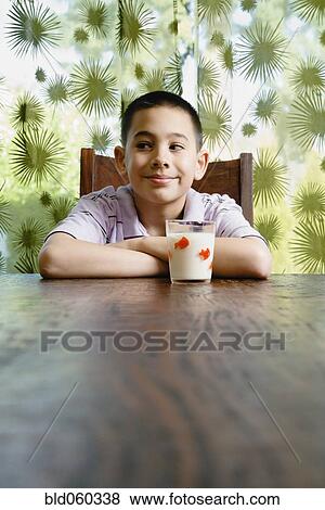 Asian boy with glass of milk View Large Photo Image Stock Photo - Asian boy with glass of milk. Fotosearch