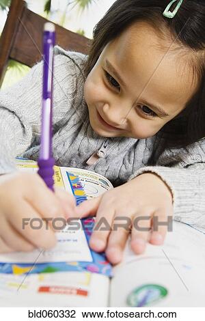 Asian girl doing homework View Large Photo Image Stock Image - Asian girl doing homework. Fotosearch