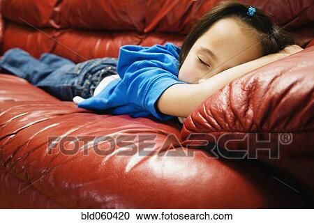 Asian girl sleeping on sofa View Large Photo Image Stock Image - Asian girl sleeping on sofa. Fotosearch