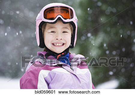 Asian girl wearing ski gear in snow View Large Photo Image Stock Image - Asian girl wearing ski gear in snow. Fotosearch