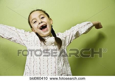 Stock Image - Asian girl with arms outstretched. Fotosearch