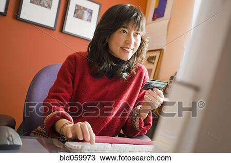 Asian woman shopping online View Large Photo Image Stock Image - Asian woman shopping online. Fotosearch