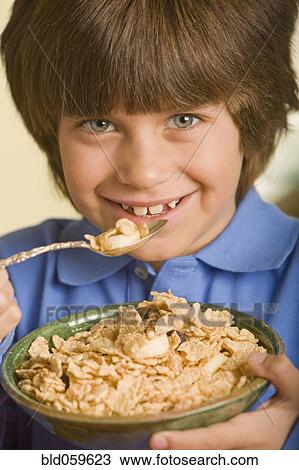 Hispanic boy eating cereal View Large Photo Image Stock Image - Hispanic boy eating cereal. Fotosearch