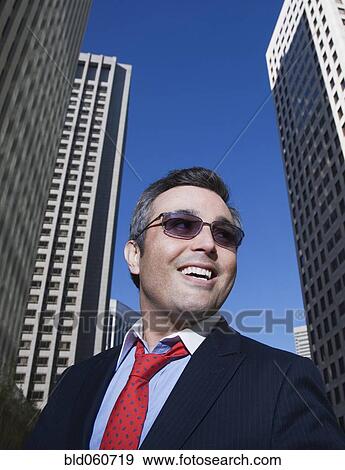 Stock Photo - Hispanic businessman wearing sunglasses. Fotosearch