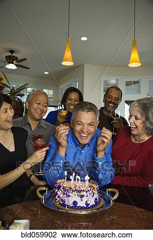 Hispanic man celebrating birthday with multi-ethnic friends View Large Photo Image Stock Image - Hispanic man celebrating birthday with multi-ethnic friends. Fotosearch