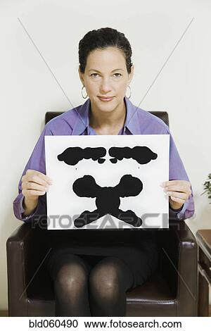 Mixed Race female psychiatrist holding ink blot View Large Photo Image Stock Image - Mixed Race female psychiatrist holding ink blot. Fotosearch