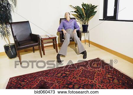 Mixed Race woman sitting in waiting area View Large Photo Image Stock Image - Mixed Race woman sitting in waiting area. Fotosearch