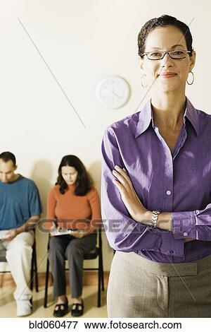 Stock Photo - Mixed Race woman with arms crossed. Fotosearch