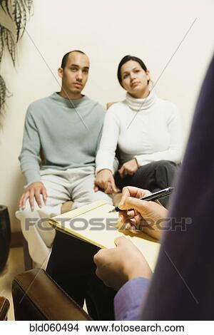 Picture - Multi-ethnic couple at therapy session. Fotosearch