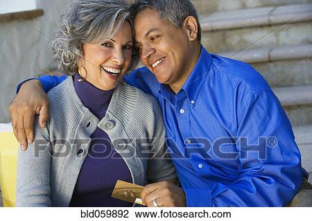 Multi-ethnic couple hugging View Large Photo Image Stock Image - Multi-ethnic couple hugging. Fotosearch