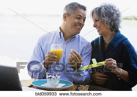 Multi-ethnic couple taking vitamins View Large Photo Image Stock Image - Multi-ethnic couple taking vitamins. Fotosearch