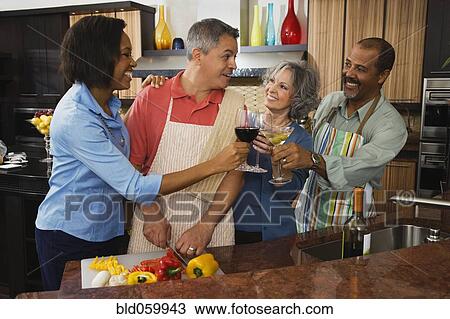 Multi-ethnic friends toasting with wine View Large Photo Image Stock Image - Multi-ethnic friends toasting with wine. Fotosearch