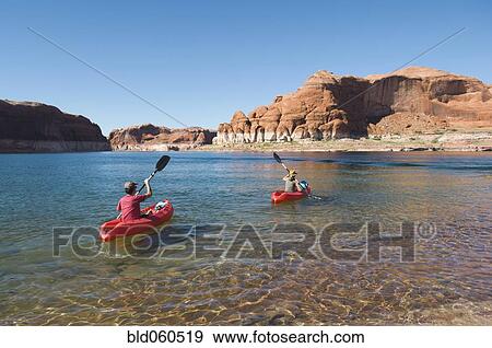 Stock Photo - People kayaking in lake. Fotosearch