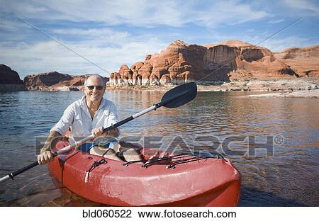 Senior man sitting in kayak View Large Photo Image Stock Image - Senior man sitting in kayak. Fotosearch