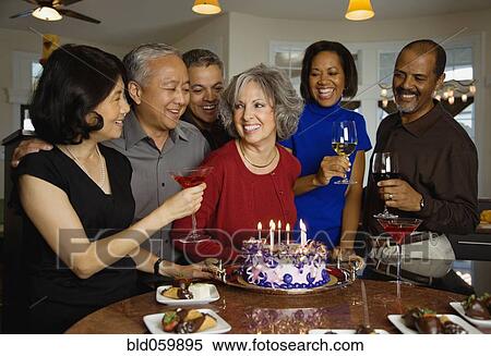 Woman celebrating birthday with multi-ethnic friends View Large Photo Image Stock Photography - Woman celebrating birthday with multi-ethnic friends. Fotosearch