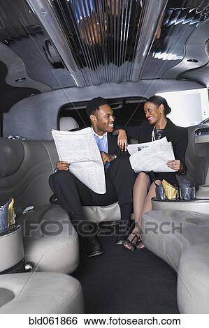Stock Photograph - African businesspeople in limousine. Fotosearch