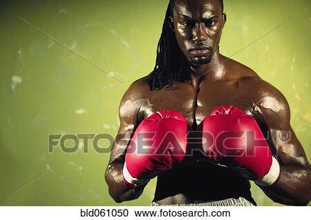 African male boxer wearing gloves View Large Photo Image Stock Image - African male boxer wearing gloves. Fotosearch