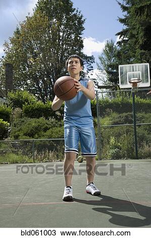 Asian boy playing basketball View Large Photo Image Stock Image - Asian boy playing basketball. Fotosearch