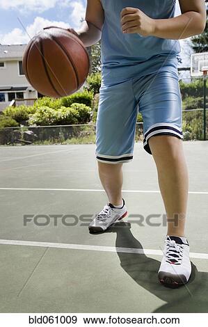Asian boy playing basketball View Large Photo Image Stock Photo - Asian boy playing basketball. Fotosearch