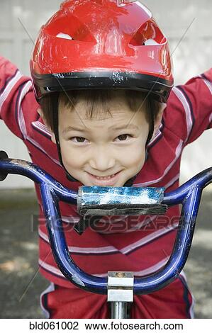 Asian boy riding bicycle View Large Photo Image Stock Image - Asian boy riding bicycle. Fotosearch