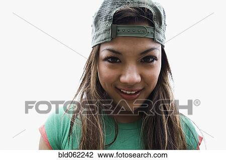 Asian woman posing in backwards cap View Large Photo Image Stock Image - Asian woman posing in backwards cap. Fotosearch