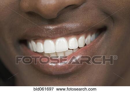 Stock Photo - Close up of African woman’s mouth. Fotosearch