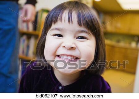 Close up of mixed race girl grinning View Large Photo Image Stock Photo - Close up of mixed race girl grinning. Fotosearch