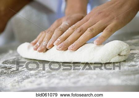 Close up of woman rolling dough View Large Photo Image Stock Photo - Close up of woman rolling dough. Fotosearch