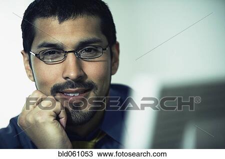 Hispanic businessman wearing eyeglasses View Large Photo Image Stock Image - Hispanic businessman wearing eyeglasses. Fotosearch
