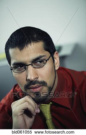 Hispanic businessman wearing eyeglasses View Large Photo Image Stock Photography - Hispanic businessman wearing eyeglasses. Fotosearch