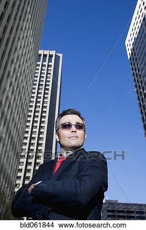 Hispanic businessman with arms crossed View Large Photo Image Picture - Hispanic businessman with arms crossed. Fotosearch