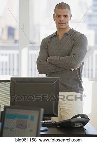 Hispanic businessman with arms crossed View Large Photo Image Stock Photo - Hispanic businessman with arms crossed. Fotosearch