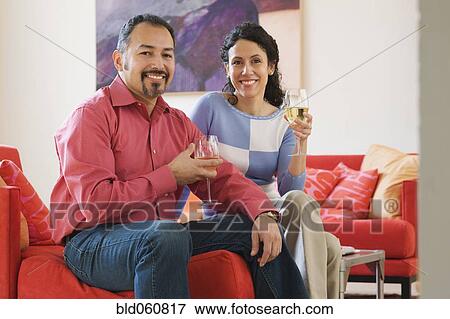 Stock Photo - Hispanic couple drinking wine. Fotosearch