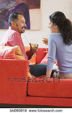 Stock Photo - Hispanic couple drinking wine. Fotosearch
