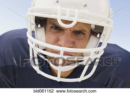 Hispanic male football player wearing helmet View Large Photo Image Stock Image - Hispanic male football player wearing helmet. Fotosearch