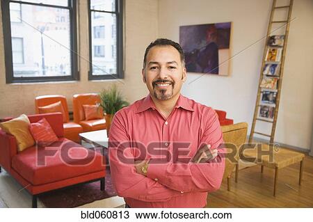Stock Image - Hispanic man with arms crossed. Fotosearch