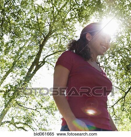 Hispanic woman in sunlight View Large Photo Image Stock Photography - Hispanic woman in sunlight. Fotosearch