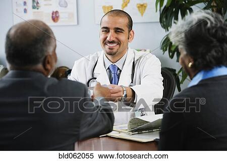 Lebanese male doctor handing patient prescription View Large Photo Image Stock Photography - Lebanese male doctor handing patient prescription. Fotosearch