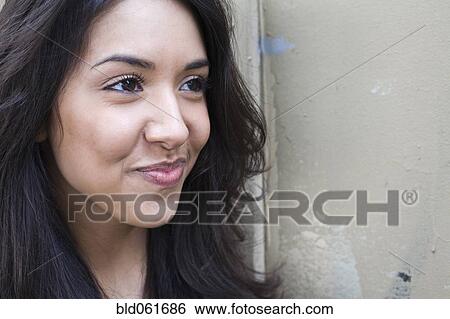 Stock Photograph - Middle Eastern woman smirking. Fotosearch