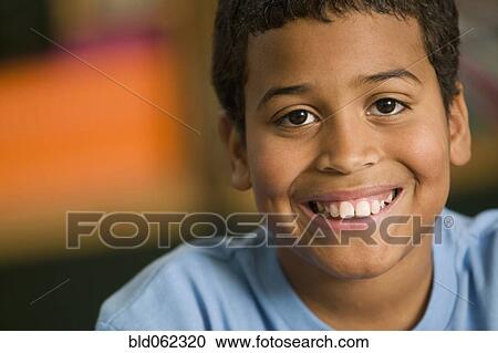 Mixed race boy smiling View Large Photo Image Stock Image - Mixed race boy smiling. Fotosearch