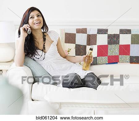 Mixed Race woman talking on telephone View Large Photo Image Picture - Mixed Race woman talking on telephone. Fotosearch