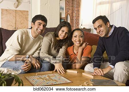 Multi-ethnic family playing board game View Large Photo Image Picture - Multi-ethnic family playing board game. Fotosearch
