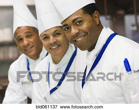Multi-ethnic male chefs in a row View Large Photo Image Stock Photo - Multi-ethnic male chefs in a row. Fotosearch
