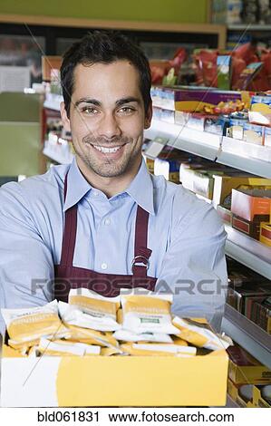 Pacific Islander clerk in health food store View Large Photo Image Stock Image - Pacific Islander clerk in health food store. Fotosearch