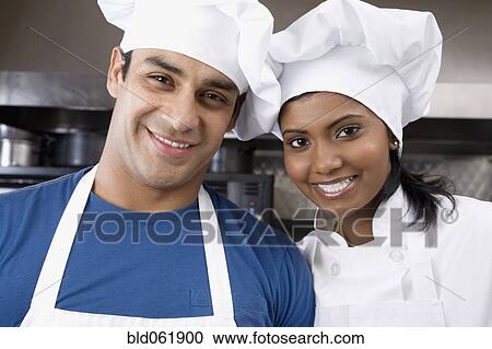 Stock Image - Portrait of multi-ethnic pastry chefs. Fotosearch