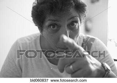 Stock Photo - Senior woman pointing. Fotosearch