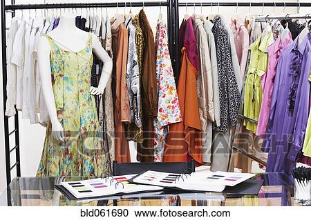 Textile swatches and mannequin in front of clothing rack View Large Photo Image Stock Image - Textile swatches and mannequin in front of clothing rack. Fotosearch